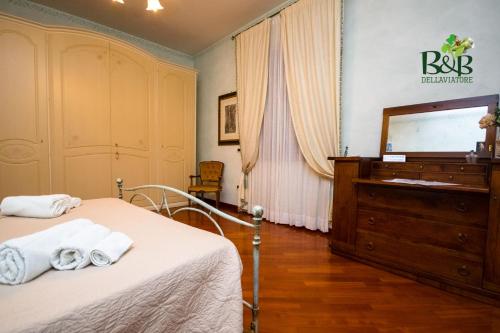 a bedroom with a bed and a flat screen tv at B&B dell'Aviatore in San Liberato