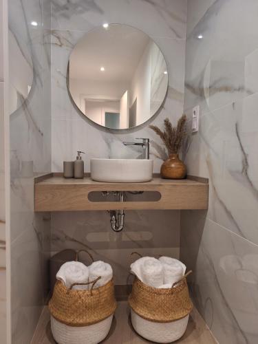 a bathroom with a sink and a mirror at Aromas del Jiloca, la Trufa Negra in Calamocha