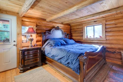 a bedroom with a bed in a log cabin at Philipsburg Log Cabin - Direct Ski Lift Access! in Georgetown