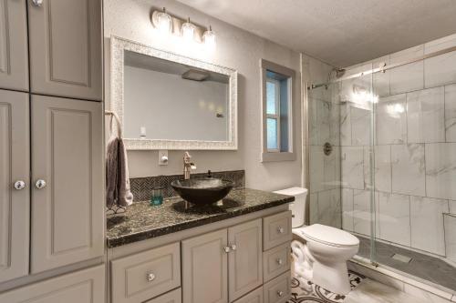 a bathroom with a sink and a toilet at Peaceful Renton Retreat with Hot Tub Access! in Renton