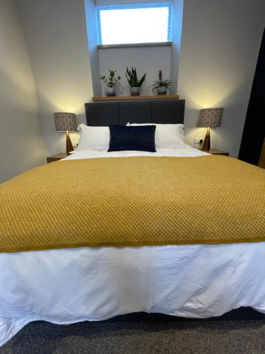 Katil atau katil-katil dalam bilik di Rooms at Allium
