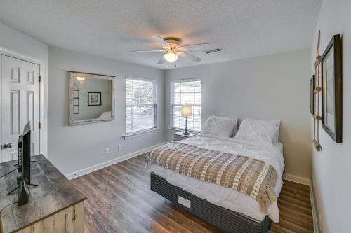 a bedroom with a bed and a ceiling fan at Murrells Inlet Vacation Rental about 4 Mi to the Beach in Myrtle Beach