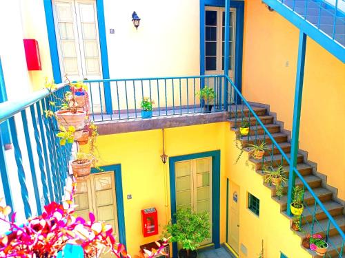 a building with stairs and potted plants on it at CASONA SANTA MARTA in Arequipa