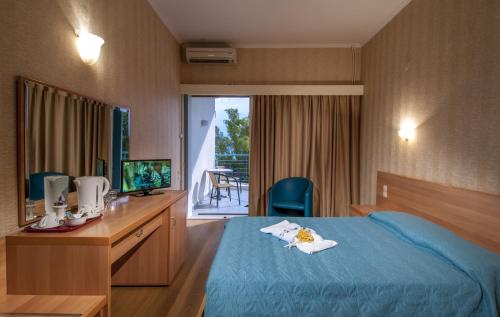 Säng eller sängar i ett rum på Florida Blue Bay Resort & Spa