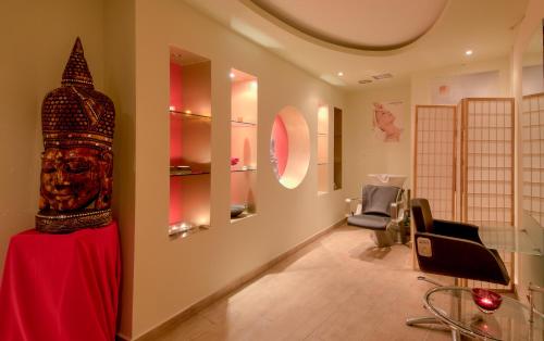 a room with a table with a head on the wall at Florida Blue Bay Resort & Spa in Psathopirgos