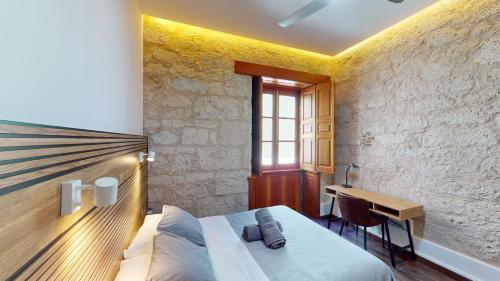 Postel nebo postele na pokoji v ubytování Triana Rooms EH