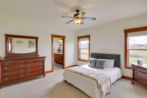 a bedroom with a bed and a dresser and a mirror at 9 Mi to Downtown Bozeman Vacation Home with Hot Tub in Bozeman