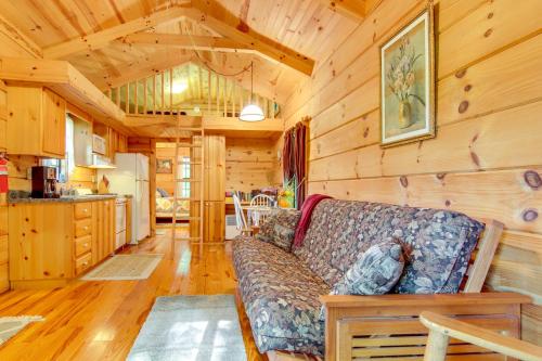 a living room with a couch in a cabin at Hendersonville Creekside Cabin Near DuPont Forest in Hendersonville