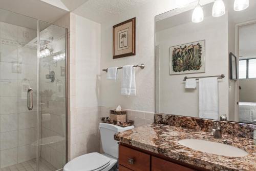 a bathroom with a toilet and a shower and a sink at Maui Parkshore 209 - MCH in Kihei