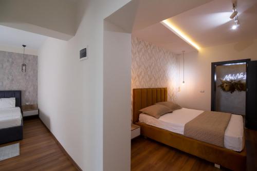 Ένα ή περισσότερα κρεβάτια σε δωμάτιο στο Melnaz Apartament 3
