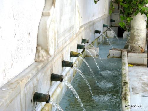 a fountain in a building with water coming out of it at Centro Vacacional Macenas in Mojácar