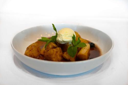 a bowl of food with a scoop of ice cream at Park Inn by Radisson Oslo Airport Hotel West in Gardermoen