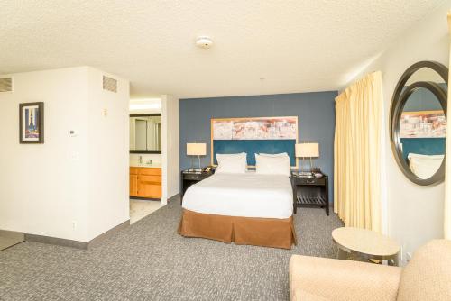 a hotel room with a bed and a living room at Philadelphia Suites at Airport - An Extended Stay Hotel in Philadelphia