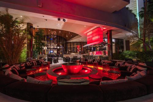 a lobby with a large couch and a bar at Red Rock Casino Resort & Spa in Las Vegas