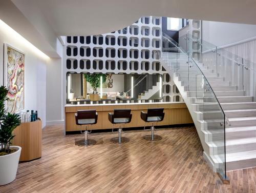 a salon with a staircase and bar stools at Red Rock Casino Resort & Spa in Las Vegas