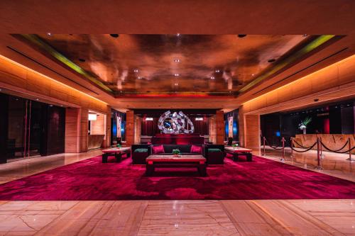 a lobby with a couch and a table in a room at Red Rock Casino Resort & Spa in Las Vegas