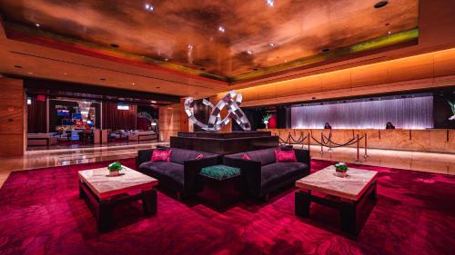 a living room with couches and a stage at Red Rock Casino Resort & Spa in Las Vegas