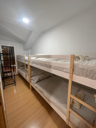 A bed or beds in a room at BUENAVISTA DELUXE