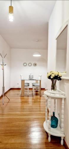 a living room with a table and a dining room at Ocean Pearl Apartment K in Funchal