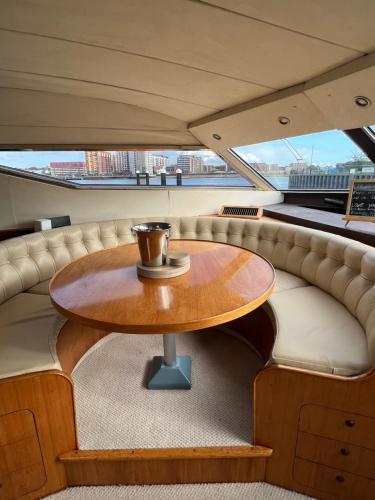 a table in the back of a boat at SUPERYACHT ON TOWN QUAY MARINA, SOUTHAMPTON - Very close to city centre and cruise terminals - free parking included in Southampton