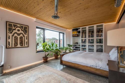 a bedroom with a bed and a window at Cozy BNB - Halifax Rooftop - The Sunrise Room in Halifax