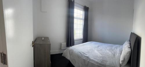 Ein Bett oder Betten in einem Zimmer der Unterkunft East Street