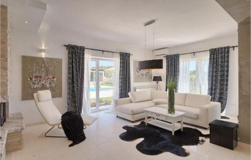 a living room with a couch and chairs and a table at Villa Piccolo Paradiso in Rovinj