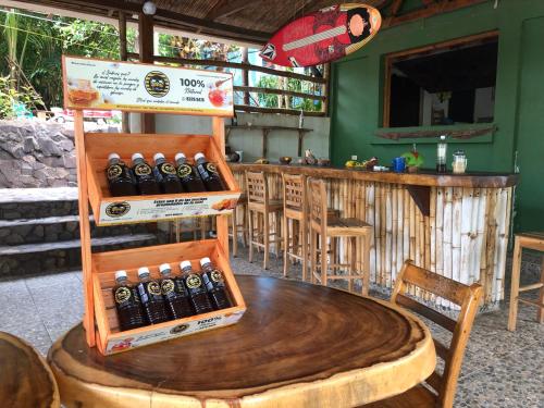 a table with a bunch of bottles of beer at El Marabu Chill'n Surf in Aposentillo