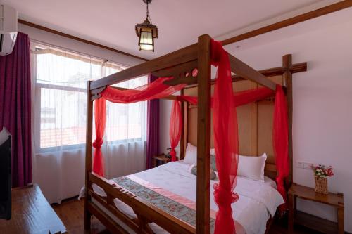 Cama o camas de una habitación en Zhangjiajie Yueting Eco Inn