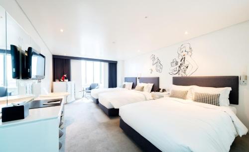 Un pat sau paturi într-o cameră la Imperial Palace Boutique Hotel Itaewon
