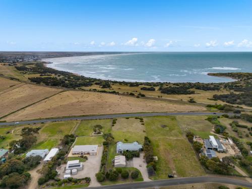 an aerial view of a house and the beach at Sea Breeze - Spacious home with lovely ocean views in Port Elliot