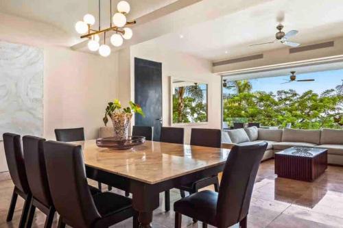 a dining room with a wooden table and chairs at Free Transport ~OCEAN VIEWS~ Romantic zone in Puerto Vallarta