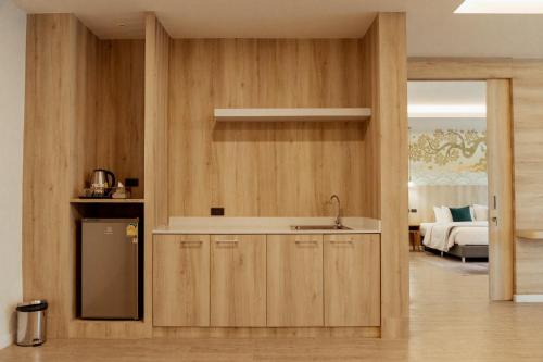 a kitchen with a sink and a counter top at RUS Hotel&Convention Ayutthaya in Phra Nakhon Si Ayutthaya