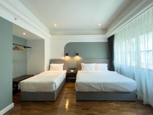Ένα ή περισσότερα κρεβάτια σε δωμάτιο στο Hotel Seri Costa