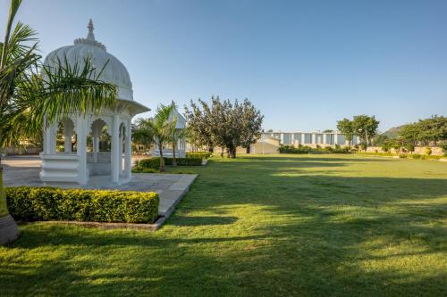 a gazebo in the middle of a park at Sterling Balicha Udaipur in Udaipur