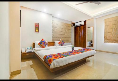 a bedroom with a large bed in a room at NirVana Lodge in Guwahati