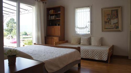 מיטה או מיטות בחדר ב-Chambre d'hôtes Ananda