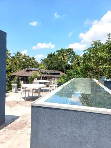 a plunge pool on the roof of a house at Gampaha Heritage in Gampaha