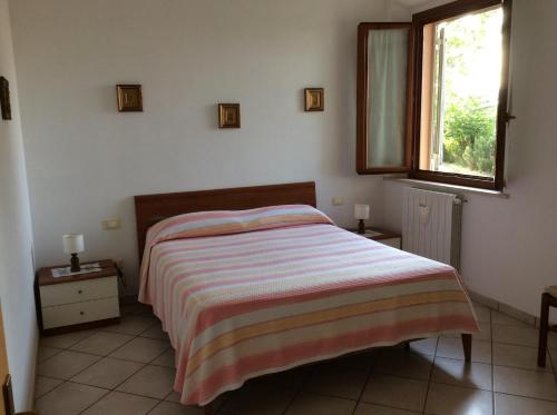 En eller flere senge i et værelse på Agriturismo Susanna e Atria