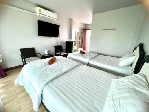 Ένα ή περισσότερα κρεβάτια σε δωμάτιο στο Fang Chayapa Hotel