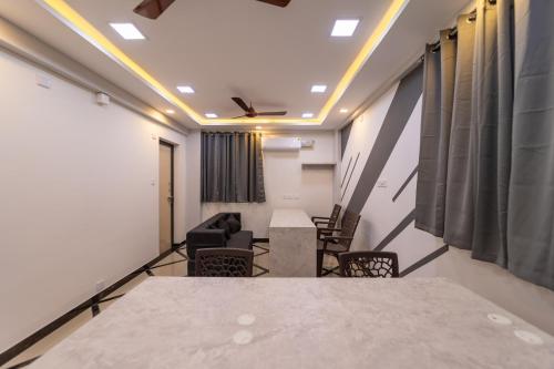 a meeting room with a table and chairs in a room at Fortune Inn in Erode