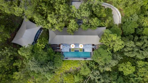 an aerial view of a house in the forest at Pemako Punakha in Punākha