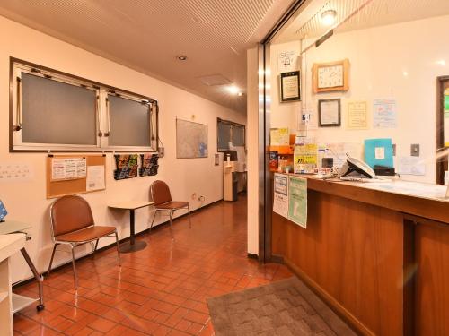 a waiting room with two chairs and a counter at Hotel Kangetsuso in Tokyo