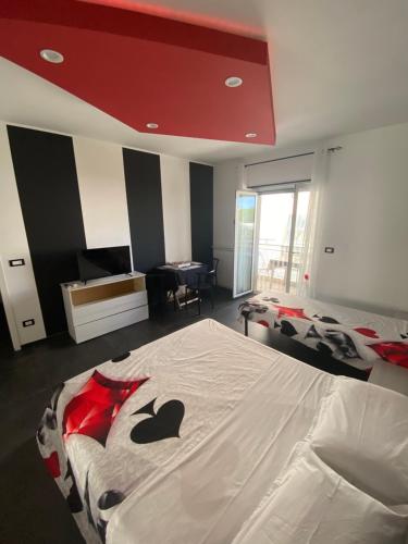 a bedroom with a bed with an apple blanket at IRIS ROOM in Monopoli