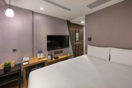 Кровать или кровати в номере 綺樂文旅 開封館 Le Room Hotel Kaifeng