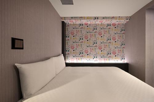 Кровать или кровати в номере 綺樂文旅 開封館 Le Room Hotel Kaifeng