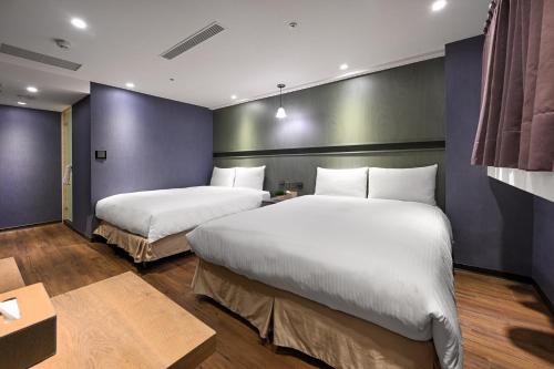 Кровать или кровати в номере 綺樂文旅 開封館 Le Room Hotel Kaifeng