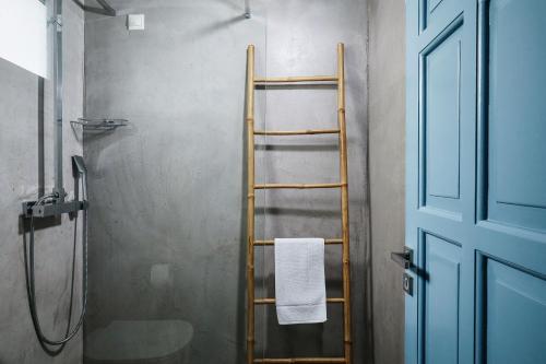 a shower with a wooden ladder in a bathroom at Chrysalis Boutique - Adults Only in Astypalaia Town