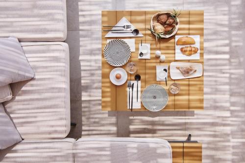an overhead view of a table with food on it at Chrysalis Boutique - Adults Only in Astypalaia Town