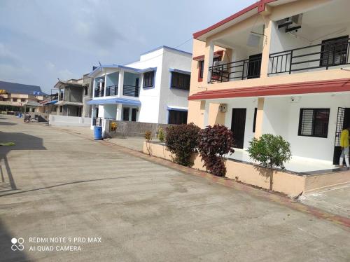 an empty street in a city with buildings at Jalsa Villas in Saputara